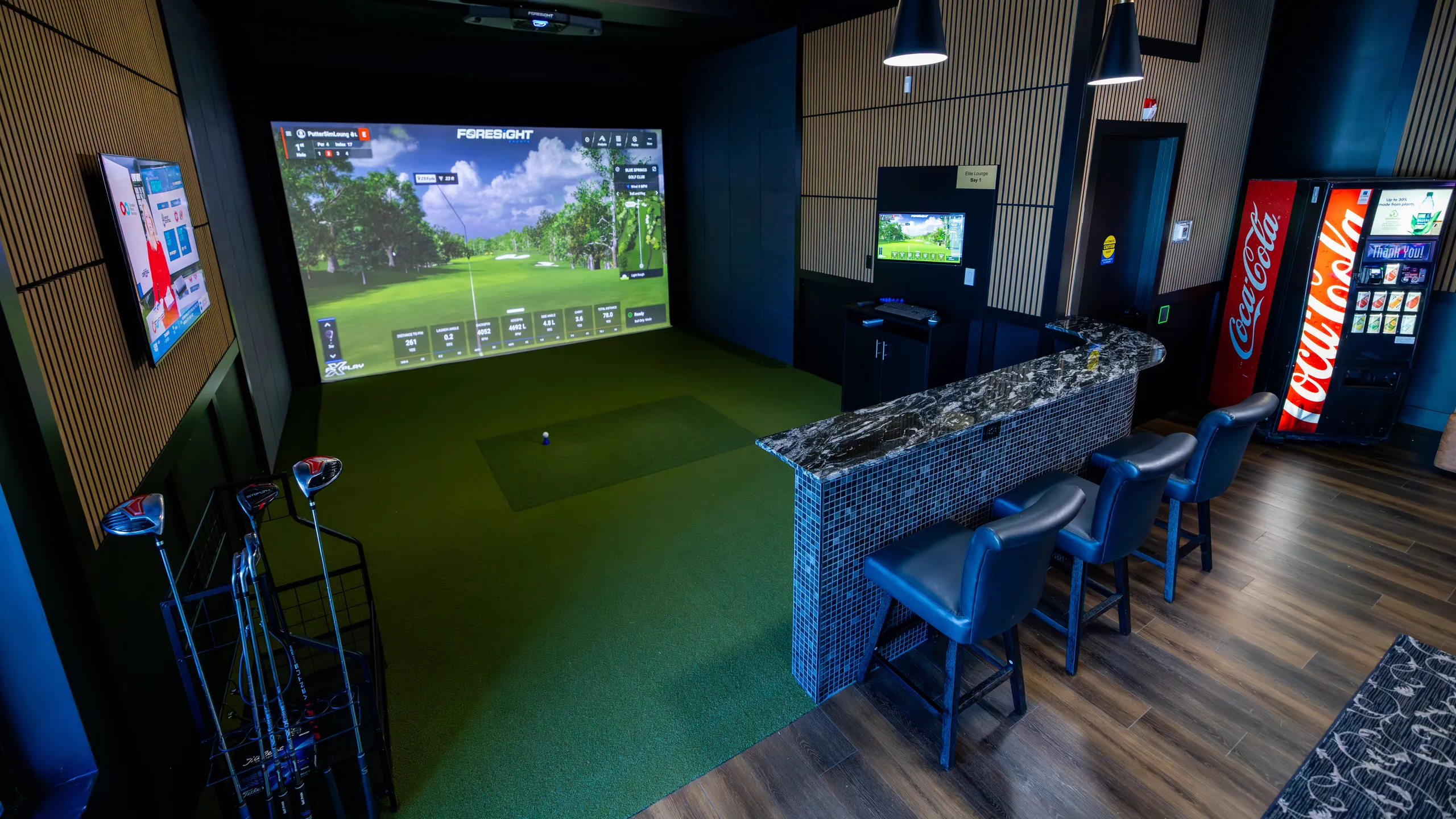 Elite Suite Bay 1 at Putter Sim Lounge: Foresight golf simulator screen with granite bar seating for four, Woodbridge in Vaughan