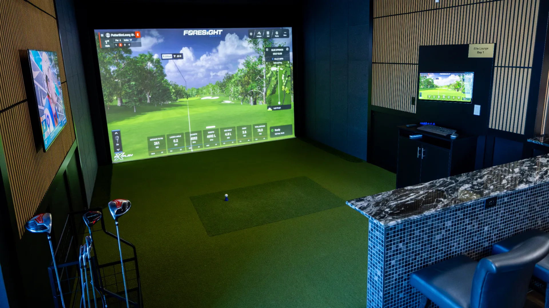 Inside Putter Sim Lounge on Weston Road in Woodbridge — Foresight Falcon simulator, clubs and the lounge bar